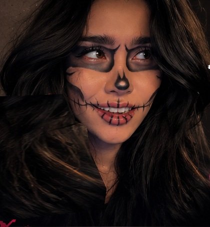 Model wearing black and white skeleton Halloween makeup