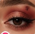 Warm eyeshadow and black winged eyeliner