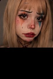 Zombie makeup look with blonde hair and painted tears